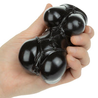 Black amine stroker misty with webbed design held in a hand against a white background