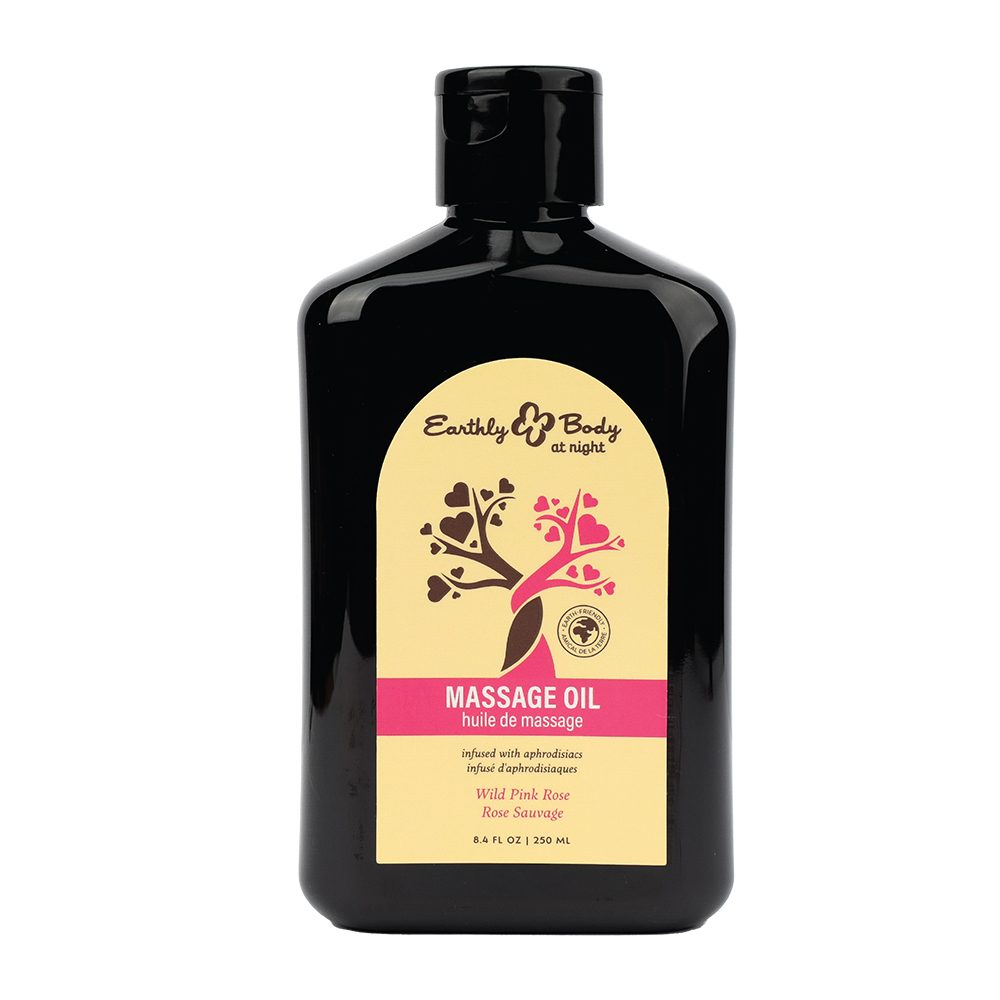 Massage oil bottle wild pink rose by earthly body with a black cap and yellow label on a white background