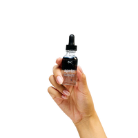 Hand holding a bottle of 'apres' with a dropper on a white background