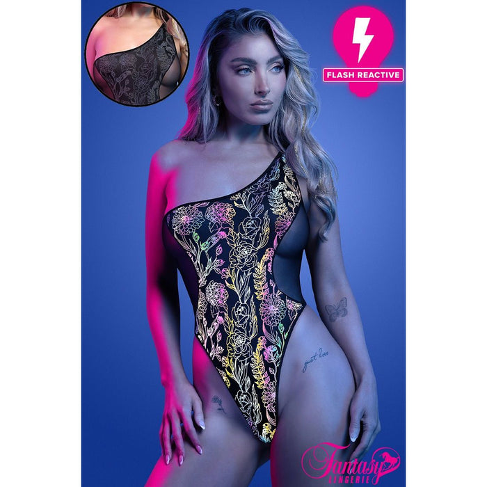 Model wearing a colorful one-piece teddy with floral patterns against a blue background.