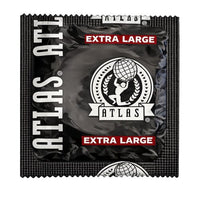 black foil pack of atlas xl condoms on white back ground