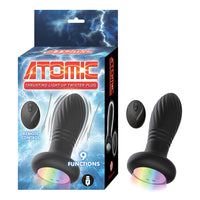 black thrusting anal butt plug with remote control beside box packaging