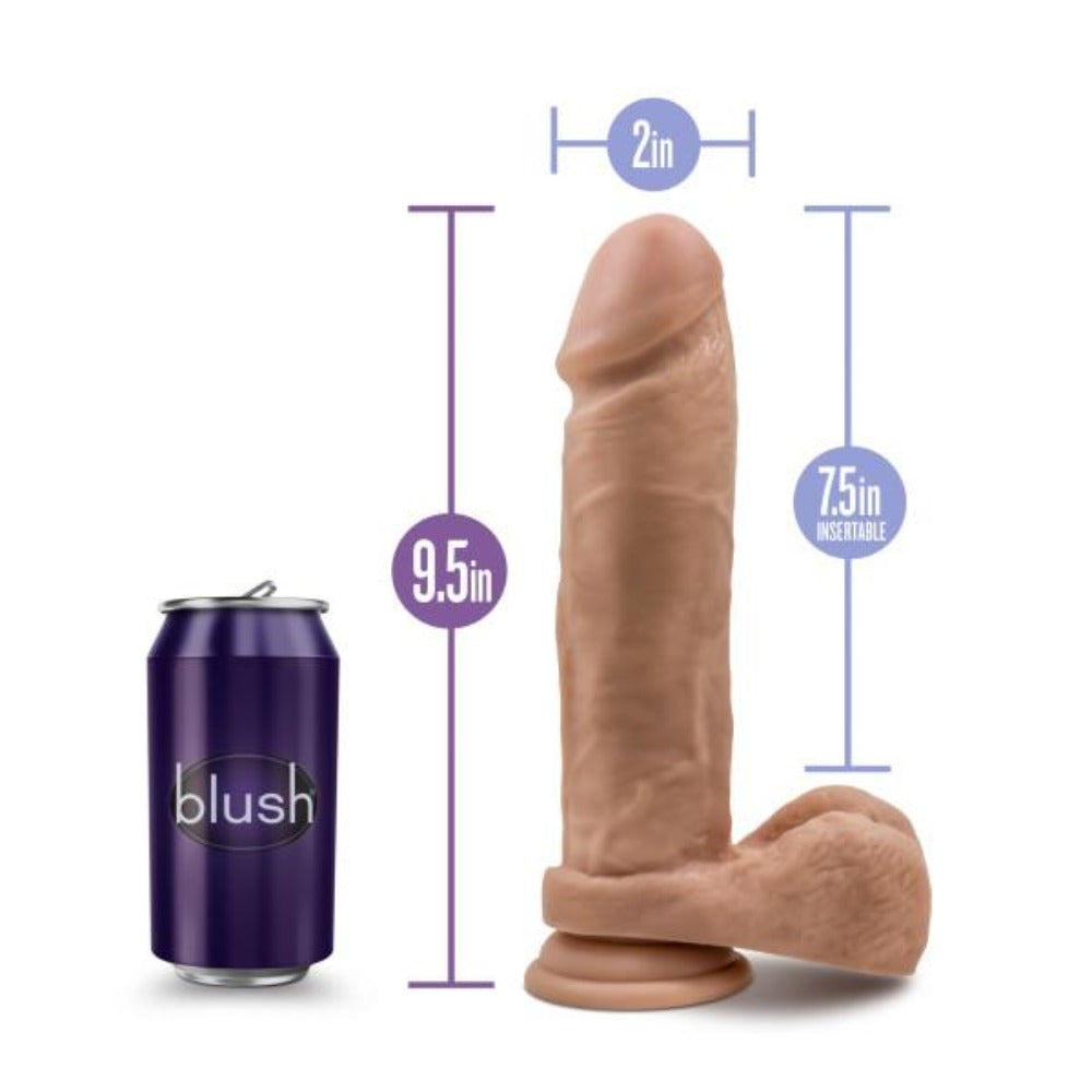 dildo with balls beside pop can and size chart