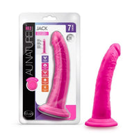 pink realistic dildo beside packaging