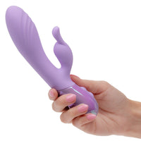 Purple aura dual bunny vibrator held in a hand against a white background