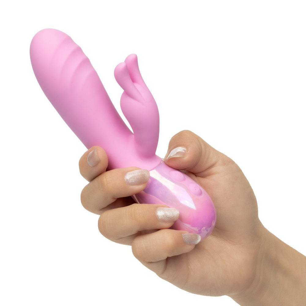 pink vibrator with bunny stimulator held in hand