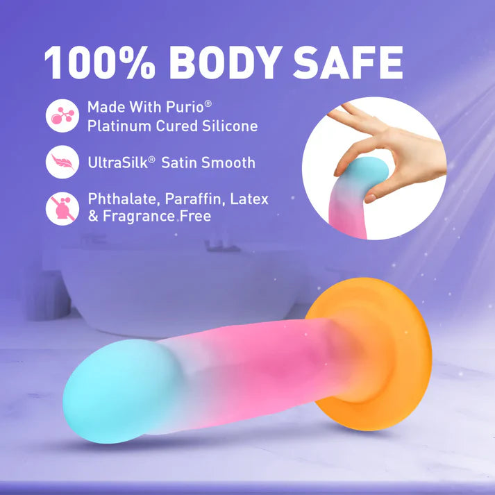 Silicone dildo with color gradient on a purple background, featuring text about safety and material composition.