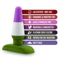 Green and purple anal plug product with safety certification labels on a white background