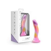 multi colored curved dildo beside box packaging