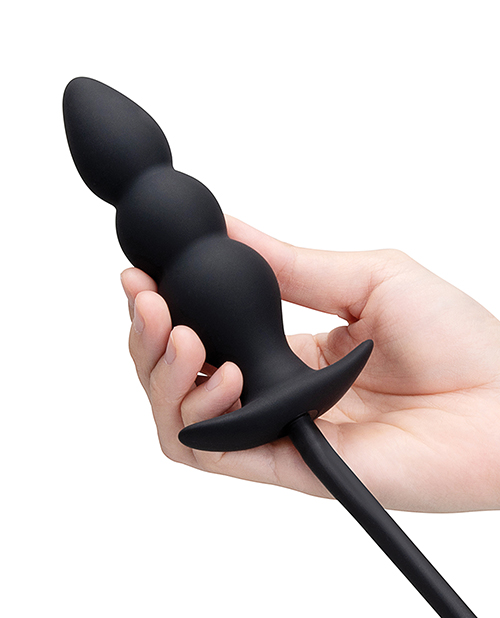 ribbed anal plug held in hand