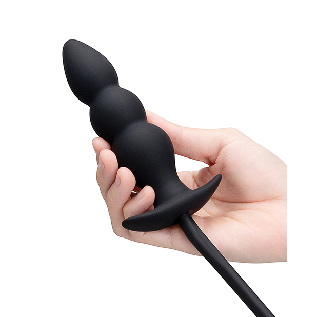 ribbed anal plug held in hand