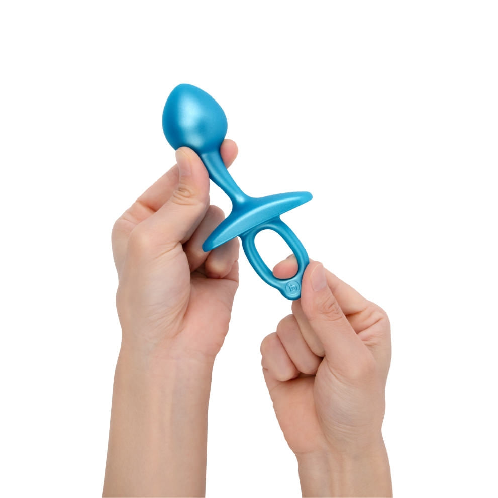 blue bulb anal plug held by 2 hands