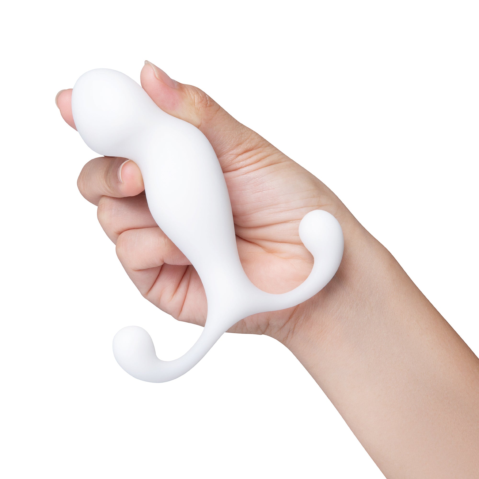 white curved anal plug held in hand
