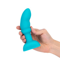 blue curved tip anal plug held in hand