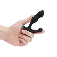 black curved anal plug held in hand