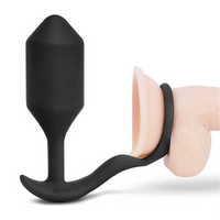 Black silicone butt plug on a white background