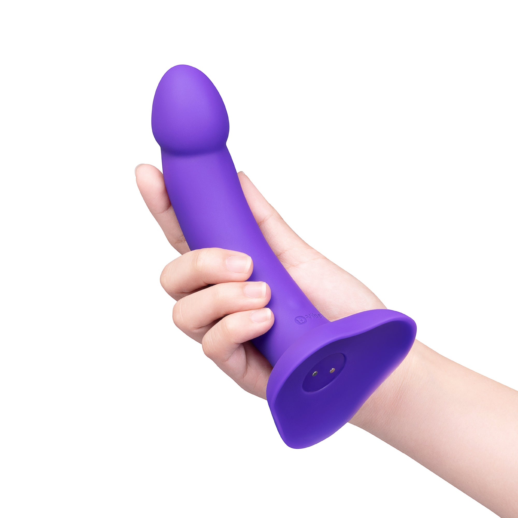 purple curved dildo held in hand