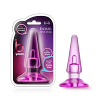 Pink anal plug with packaging on a white background