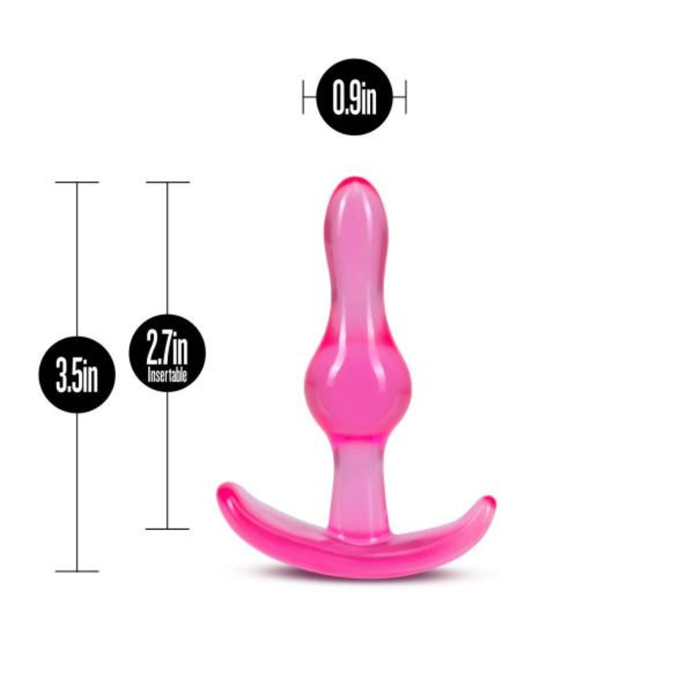 Pink plastic anal plug with measurements on a white background