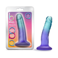 blue and purple ombre dildo with suction cup shown next to its plastic package