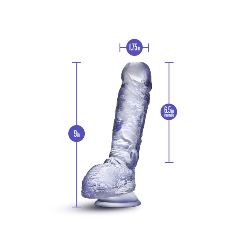 clear dildo with measurements on a white background