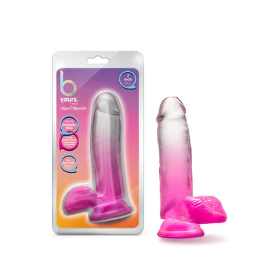 a pink to clear ombre penis shaped dildo with balls and a suction cup, shown next to its plastic packaging