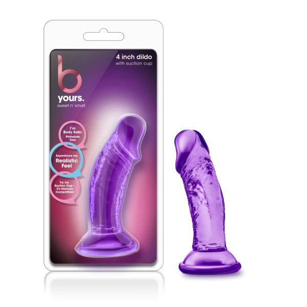a purple transparent penis shaped dildo with a suction cup shown next to its plastic packaging