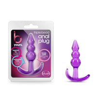 Purple triple bead anal plug with packaging on a white background