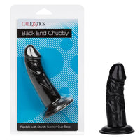 black chubby penis shaped anal plug with a suction cup base next to its plastic packaging