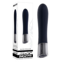 black sleek vibrating bullet, with silver handle standing beside display box