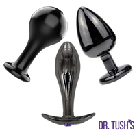 Dr. Tush’s Bad Decisions Collection featuring three glossy black metal anal plugs in Classic, Knob and Ridges shapes with flared bases.