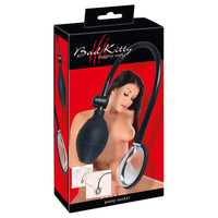 brunette female with clear pussy pump with black hose and bulb pump handle. with red and black packaging