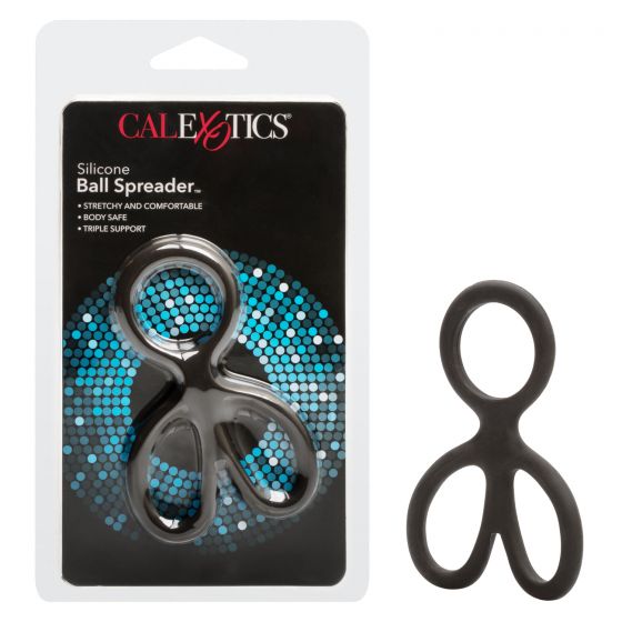 black silicone ball spreader with attached penis ring next to package