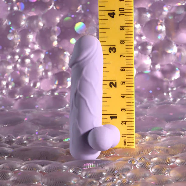 SELOPA Ballsy Bullet with a yellow ruler on a glittery purple background
