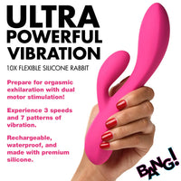 Pink silicone rabbit-shaped toy held by a hand with red nails, against a white background with promotional text.