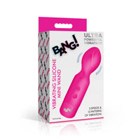 Pink vibrating silicone mini wand with packaging on a white background