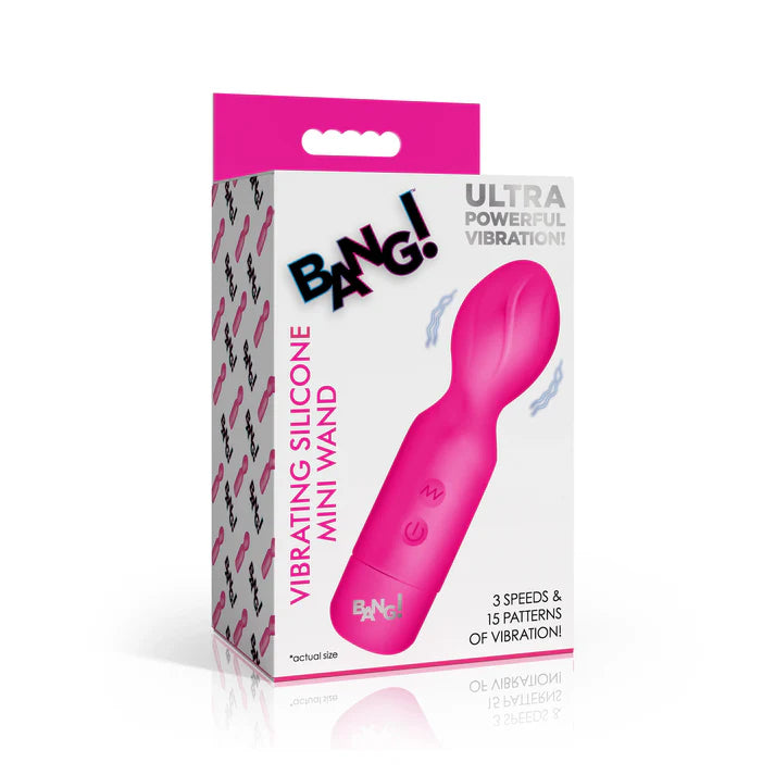Pink vibrating silicone mini wand with packaging on a white background