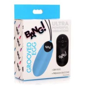 blue silicone rechargeable vibrating egg with black remote control next to bang box