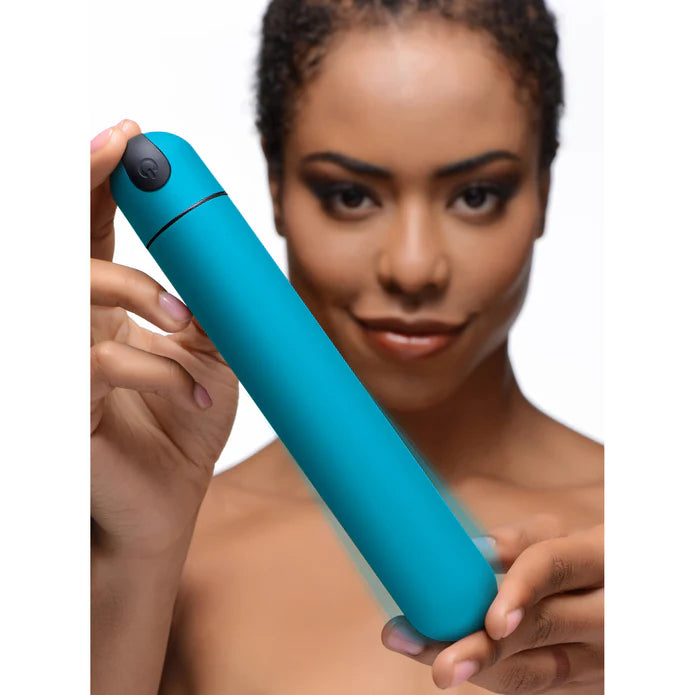 brunette female holding up xl vibrating bullet