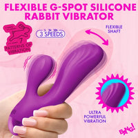 A hand holding a purple flexible rabbit-shaped vibrator with pink and purple promotional text on a pink background.