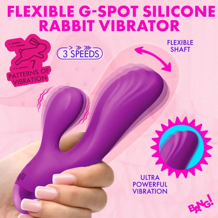 A hand holding a purple flexible rabbit-shaped vibrator with pink and purple promotional text on a pink background.