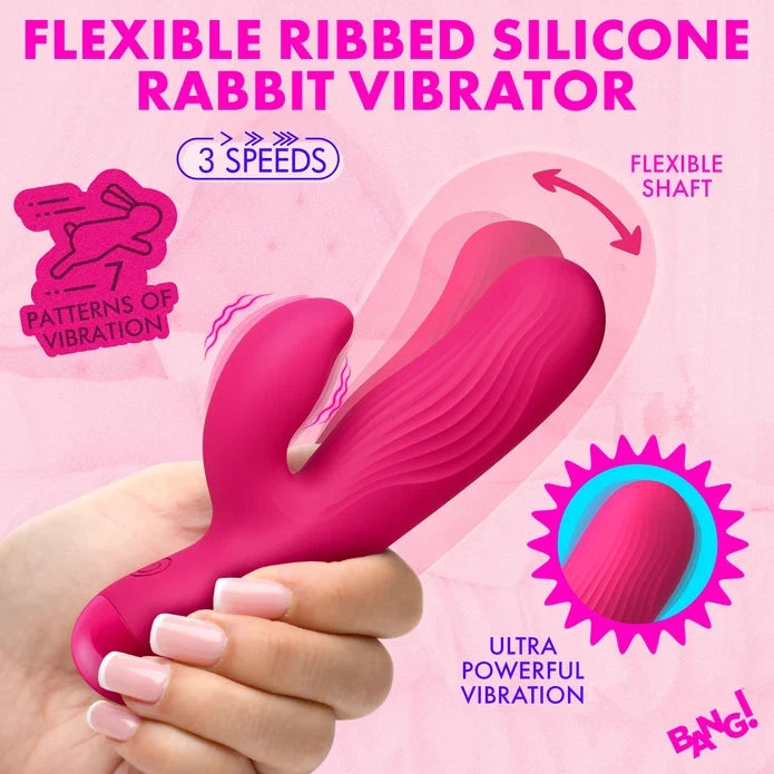 A hand holding a bright pink flexible ribbed silicone rabbit vibrator against a pink background with promotional text highlighting 3 speeds, flexible shaft, patterns of vibration, and ultra powerful vibration.