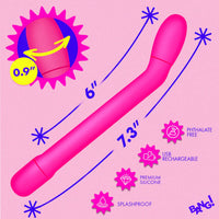 Pink toy with measurements and features on a pink background