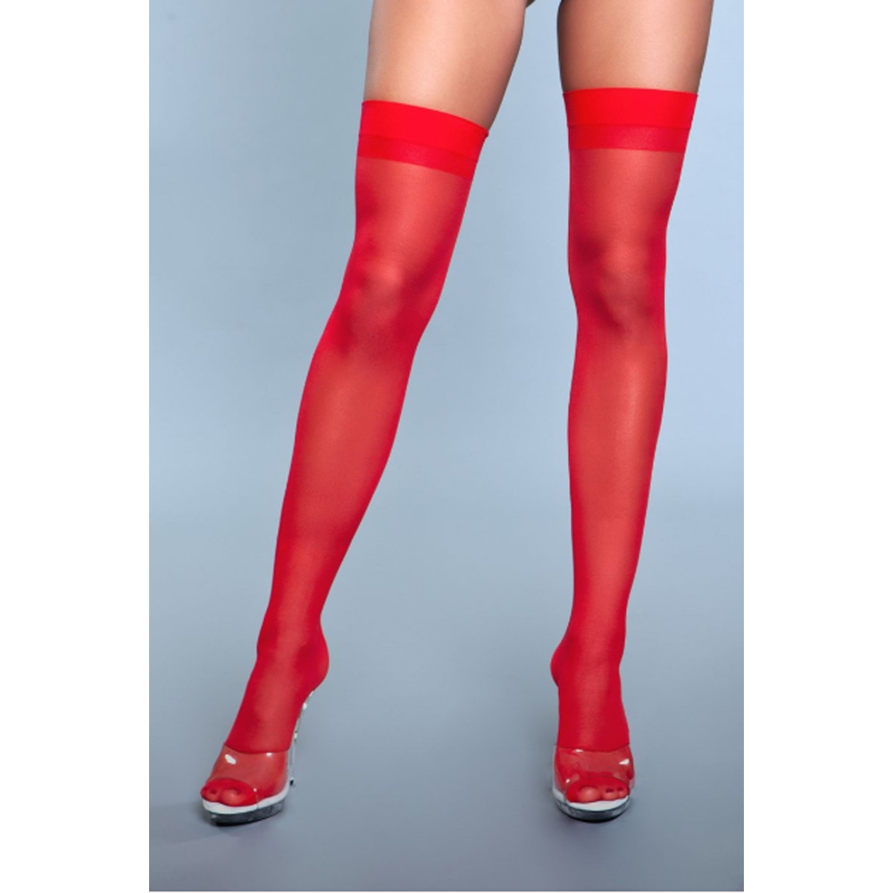 Red sheer thigh-high stockings worn by a person on a gray background