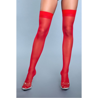 Red sheer thigh-high stockings worn by a person on a gray background
