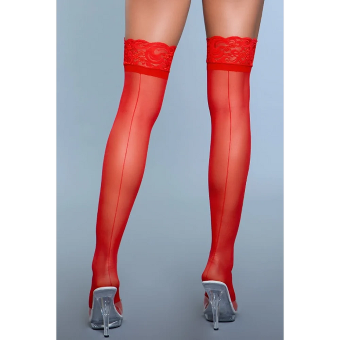 a woman wearing red sheer stockings