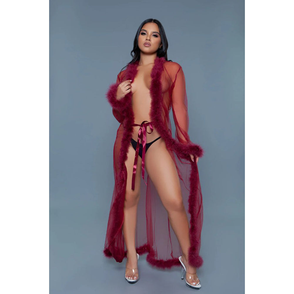 woman wearing a long sheer robe with feathers