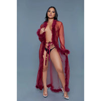 woman wearing a long sheer robe with feathers