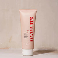Beaver Butter water based lube tube on a beige background