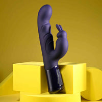 Purple abstract vibrator on a yellow geometric platform with a yellow background